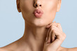 © Prostock-studio - Beauty Concept. Lovely Girl Sending Kiss With Pout Lips, Light Background