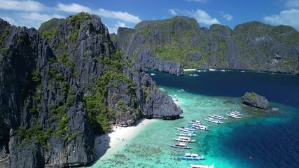 Wall Mural - Aerial view of the moored boats off the shore of Shimizu Island in El Nido, Palawan, Philippines