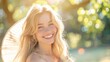 © suphamit - Beautiful blonde and white woman smiles happily outside on a sunny day. Atmosphere in the forest park