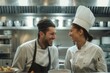 © DK_2020 - Male and female chef laughing while taking inventory in commercial kitchen