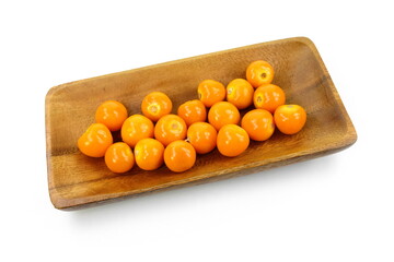 Wall Mural - Uchuva (golden berry) delicious fruit isolated on white. Cape gooseberries in a wooden bowl. Fresh fruits of Physalis peruviana, also known as golden, inca and ground berry, uchuva, poha