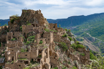 Wall Mural - Ruins of the abandoned mountain village of Gamsutl on a May day. Dagestan, Russia