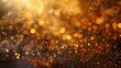 © tinnakorn - Abstract golden bokeh background with blurred lights and sparkles. Perfect for festive or celebratory designs.