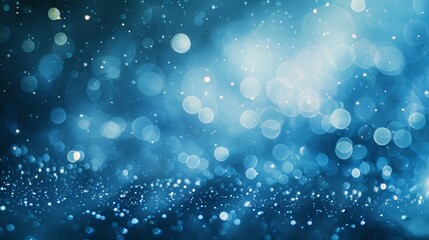 Abstract blue background with bokeh lights, perfect for holiday or winter themes.