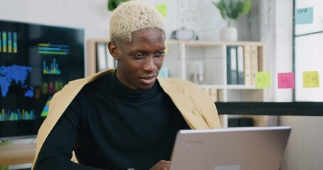Business man sit at workplace at laptop during talking to customer using remote web chat, online video conference application