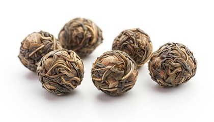 Poster - Jasmine tea balls on a white background also known as flowering or blooming tea Close up shot