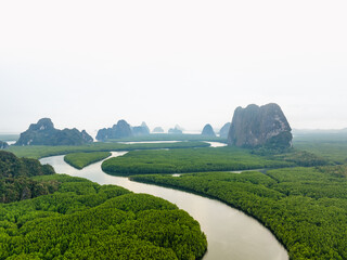 Wall Mural - View from above, aerial shot, stunning view of Ao Phang Nga (Phang Nga Bay) National Park featuring a multitude of limestone formations rising from the sea. Thailand.