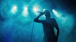 © furyon - energetic rap performance silhouetted artist on stage dramatic pose vibrant blue backdrop pulsating lights dynamic composition microphone in hand club atmosphere enthusiastic crowd