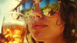 © Alison - closeup of woman wearing sunglasses in summer. Drinking beer on a sunny hot day with beer on chin and lips. Drinking alcoholic refreshments to cool down. Cocktail at the beach. Summer vacation drink.