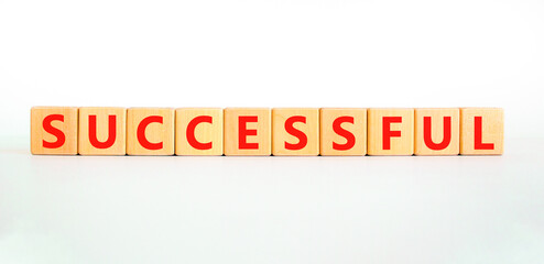 Successful symbol. Concept word Successful on beautiful wooden blocks. Beautiful white background. Business successful concept. Copy space.