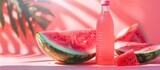 Close-up image of a watermelon juice bottle positioned on a fresh watermelon with a light pink backdrop, ideal for refreshing in summer and advertising.