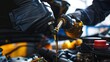 © Imron - Macro image of car mechanic changing engine oil