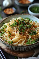 Canvas Print - Spicy garlic oil coats flat noodles with red chili flakes and garlic
