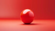 © Pixel - 3D rendering of a red sphere on a red background.