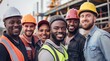 © yj - A group of diverse construction workers in hard hats and safety vests, standing together and smiling warmly, with a construction site in the background.