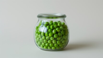 Wall Mural - Glass jar filled with closed green peas, placed on a smooth white surface