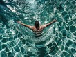 © Armir - Mswimming in pool of turquoise water