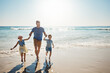© Reese Coop/peopleimages.com - Running, holding hands and father with children at beach on holiday, vacation and tropical adventure. Family, travel and happy kids with dad by ocean for bonding, playing in waves and fun on weekend