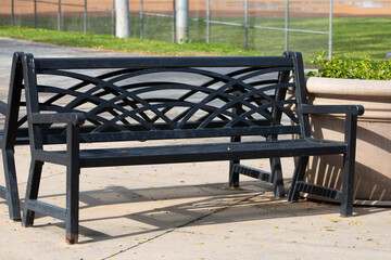 black wrought iron bench in park