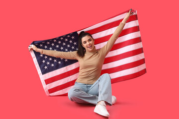 Poster - Young woman with USA flag sitting on red background