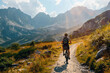 © V.Semeniuk - Mountain Biking Through Majestic Peaks on a Sunny Day