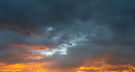 Sticker - Sky background. Bright orange sunset sky with clouds.