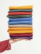 © Majella - Folded Multicolored T-Shirts Stack for Fashion Clothing Store Display Concept.