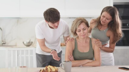 Canvas Print - Adult children calm their mother after a domestic quarrel. High quality 4k footage