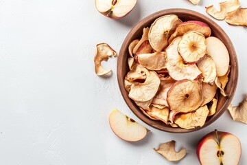 Canvas Print - Apple chips and fruit pieces in bowl on white background Vertical with space for text