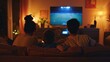 © Studium L&M - Family bonding time in living room watching sports on TV with warm cozy lighting