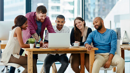 Business people, laptop and meeting for idea, collaboration or discussion on group project at the office. Diverse employees in teamwork, planning or brainstorming for online website on computer