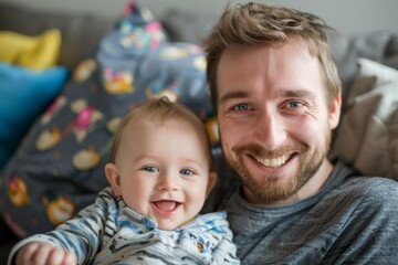 Father and baby smiling at camera