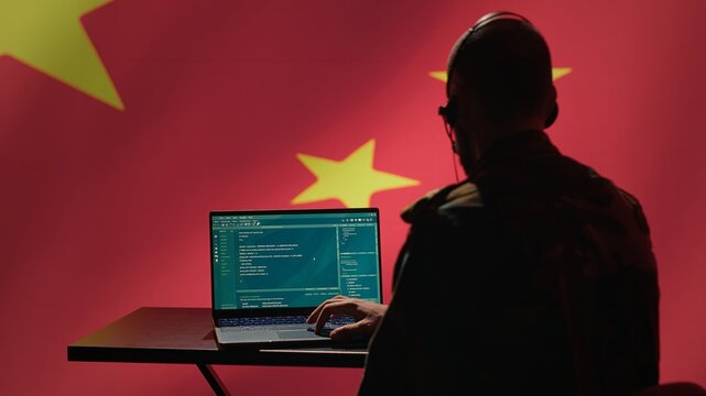 China military engineer creating fake accounts on social media to persuade other nations to act in the Chinese government interests. CCP intelligence operator spreading misinformation online, camera A