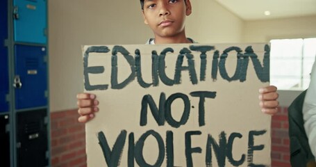 Wall Mural - School, education and face of student with poster, protest and placard of awareness with human rights. Campus, corridor or hallway with teenager boy, holding board and promote change against violence