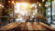 © TheWaterMeloonProjec - Wooden table on blurred cafe background for product display design