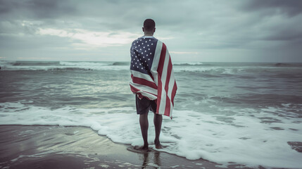 patriot on the beach with the american flag independence day