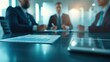 © KanitChurem - Business meeting in a modern office with executives discussing company strategy. Focus on financial document and digital tablet.