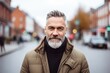 © Stocknterias - Portrait of a handsome senior man with grey beard and mustache in the city