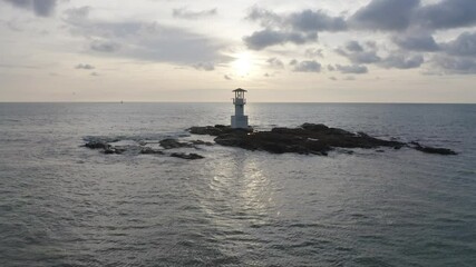 Wall Mural - Aerial top view of lighthouse tower, Khao Lak with seawater, Andaman sea in Phang Nga Bay island in summer season, Thailand. Tourist attraction.