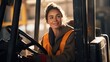 © CStock - smiling young female worker driving forklift