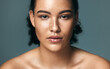 © HockleyM1/peopleimages.com - Skincare, portrait and woman in studio for beauty, wellness and acne treatment, progress or results on blue background, Face, skin and girl model with melasma, pigmentation and cosmetics for pimples