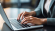 © Pakhnyushchyy - close-up of  hands of businesswoman pressing on laptop keyboard freelancer technology finance and business