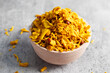 © avijit - selective focus of Indian snacks Bombay Mix on a bowl.