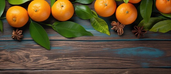 Leinwandbilder - Top view of fresh, ripe tangerines with leaves, walnuts, and cinnamon on a wooden background in a close-up image with space for text, representing a healthy organic vegetarian diet