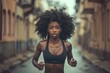 © Olena - Black Girl Running. African American Woman Jogging Outdoors for Fitness in Urban Setting