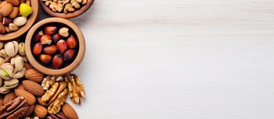 Aufkleber - Top view of a wooden bowl with assorted nuts on a white table, creating a healthy snack with walnuts, pistachios, almonds, and hazelnuts, in an image with space for writing. with copy space image