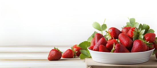 Poster - Square dish with fresh strawberries displayed on a white wooden table background, ideal as a copy space image.