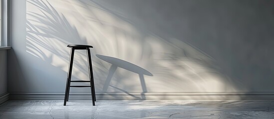 Poster - Modern bar stool beside a pale gray wall indoors, with room for a copy space image.