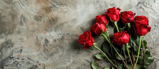 Aufkleber - Valentine's Day card with a bouquet of red roses on a stone background, featuring copy space image.