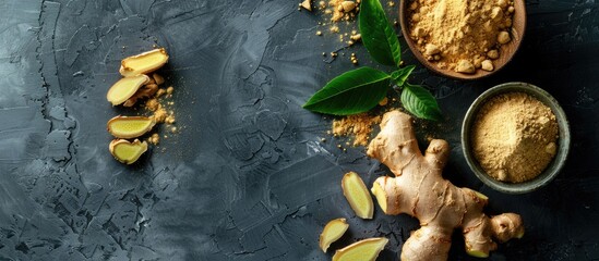 Canvas Print - Ginger powder, fresh root, and leaves displayed on a grey table in a flat lay composition, providing room for text in the image. Copy space image. Place for adding text and design